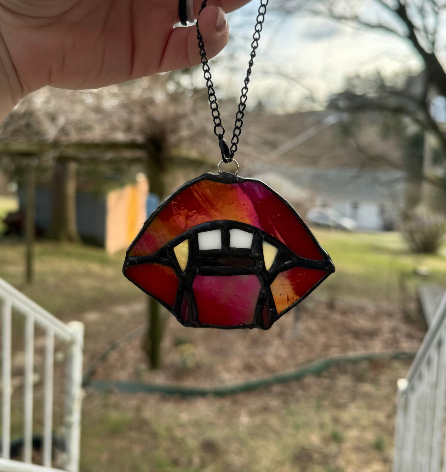 Vampire sun catcher with gold fangs